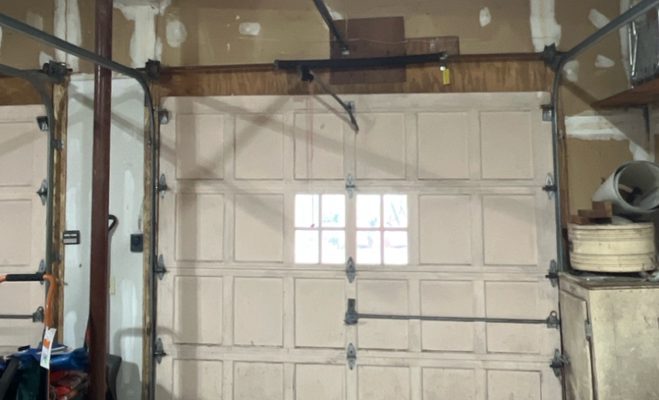 Garage door safety sensor and track repair in Tallahassee