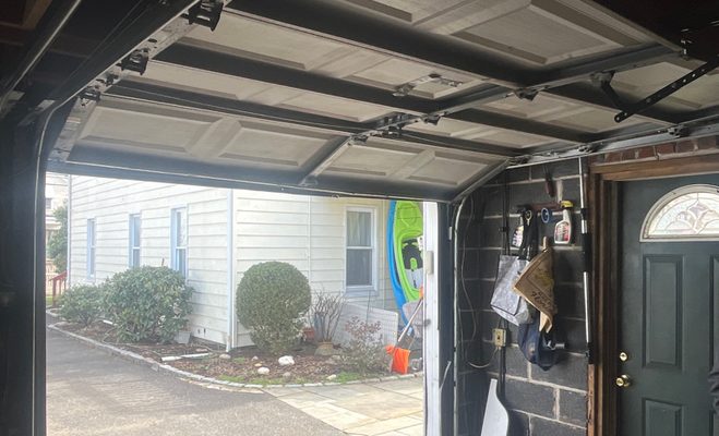 The spring snapped and the door will not lift — garage door service in Tallahassee