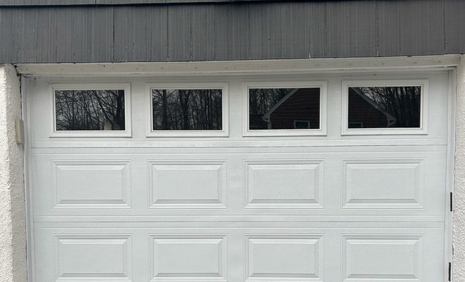 A panel is dented, split, or rotting through — garage door service in Tallahassee