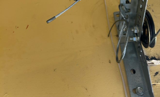 The door came off its track and sits crooked — garage door service in Tallahassee